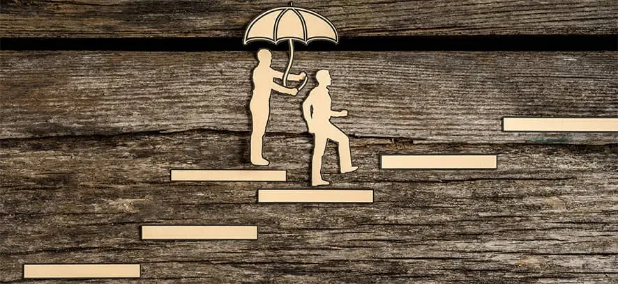 assisting another person with umbrella
