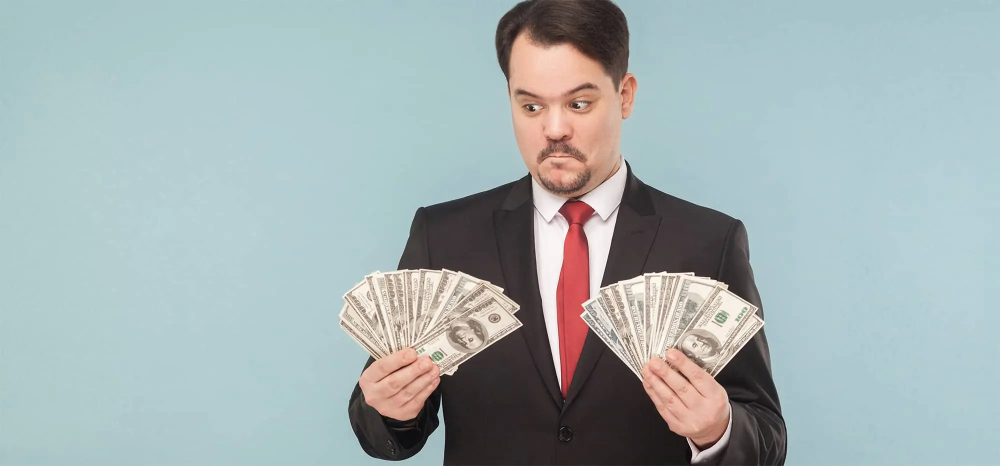 man holding dollars