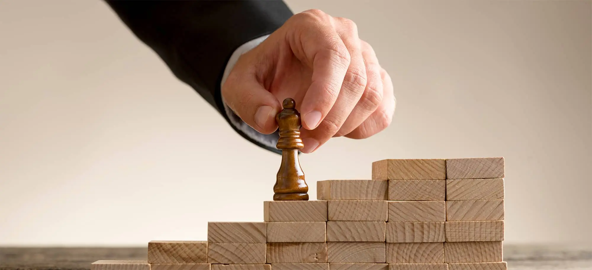 hand in chess piece with block