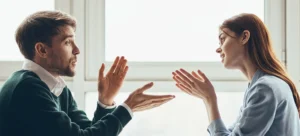 man discussing something in with woman